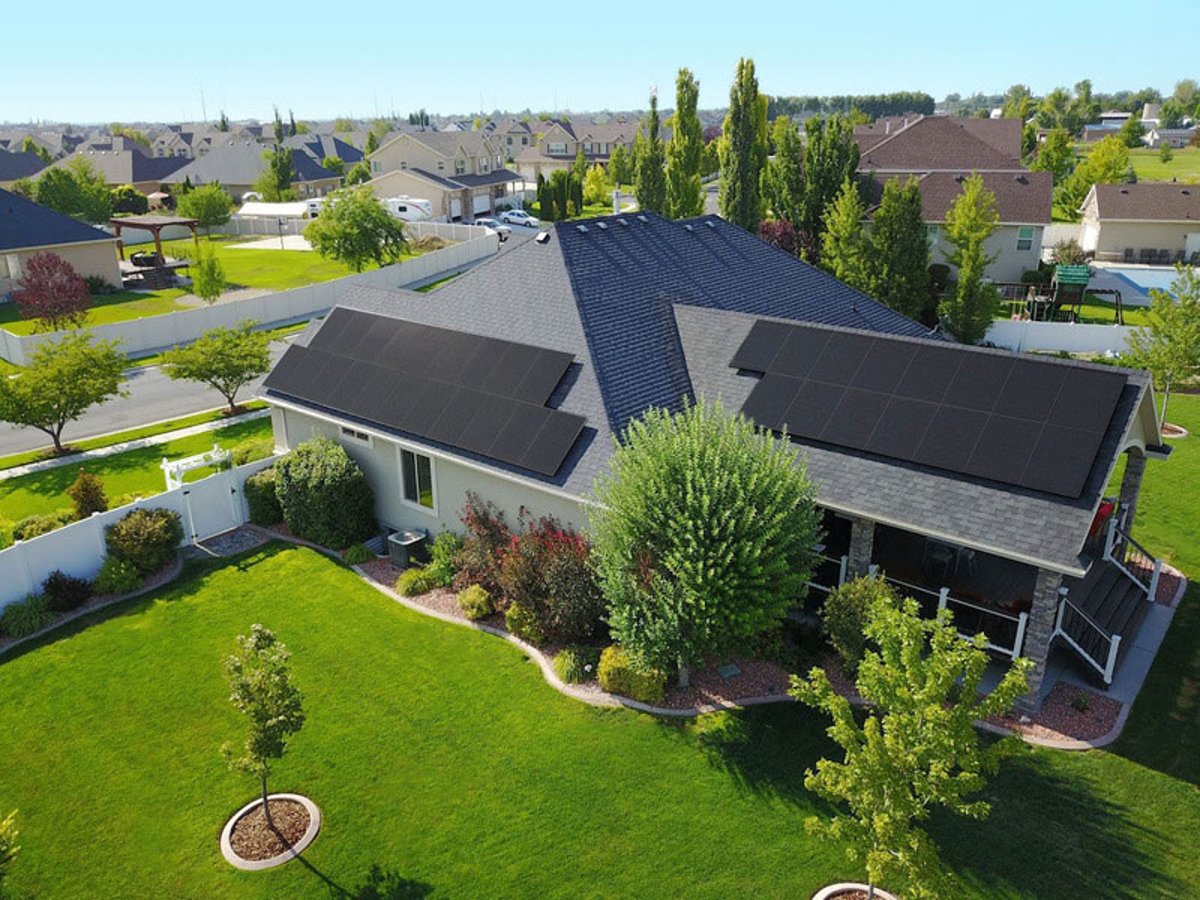 Residential home with solar panels installed by Shinnova in a suburban neighborhood