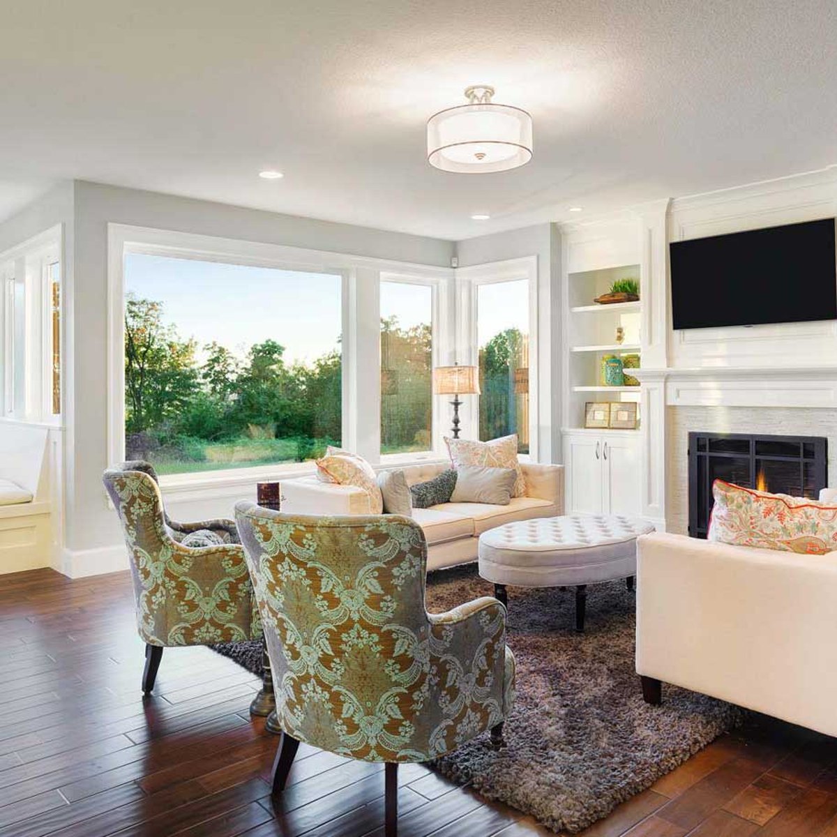 Bright living room with large energy-efficient replacement windows installed by Shinnova