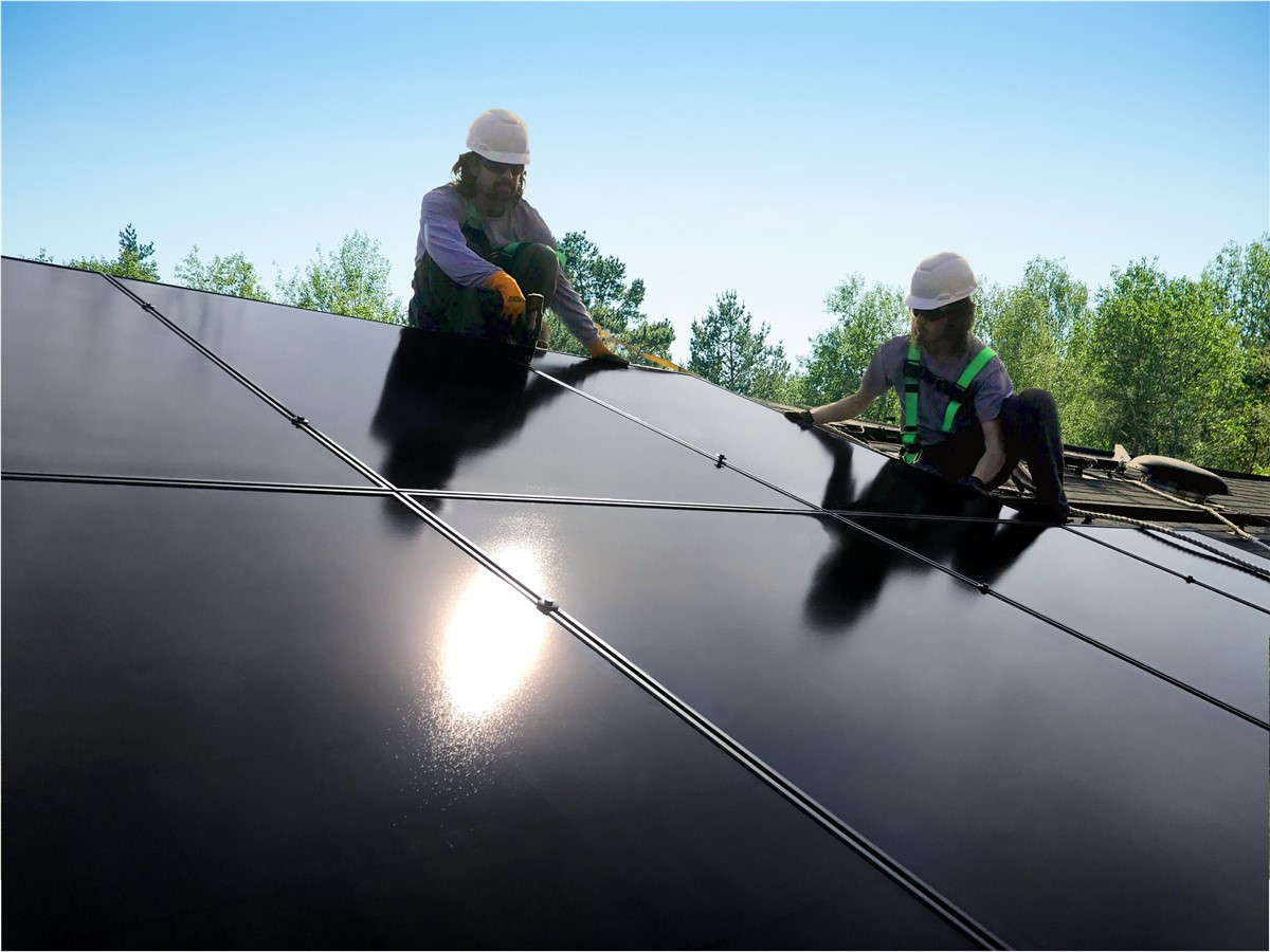 Technicians installing solar panels for Shinnova project
