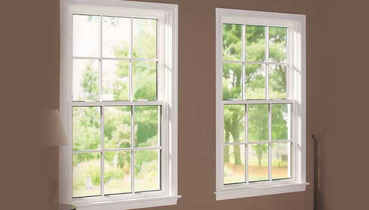 Double-hung windows with tilting sashes for easy cleaning and enhanced ventilation