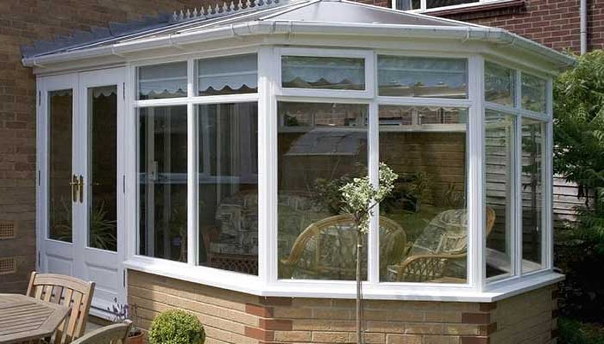 Bay and bow windows enhancing a home's exterior with additional seating space inside