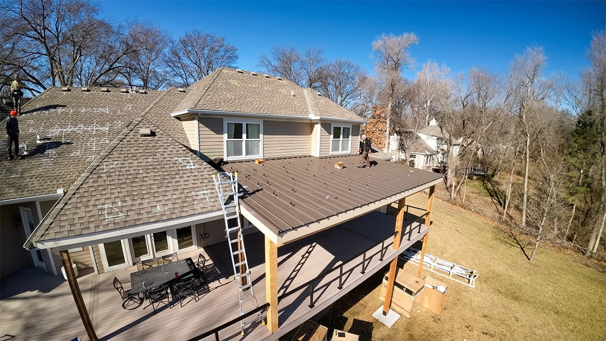 covered patio with tables and chairs